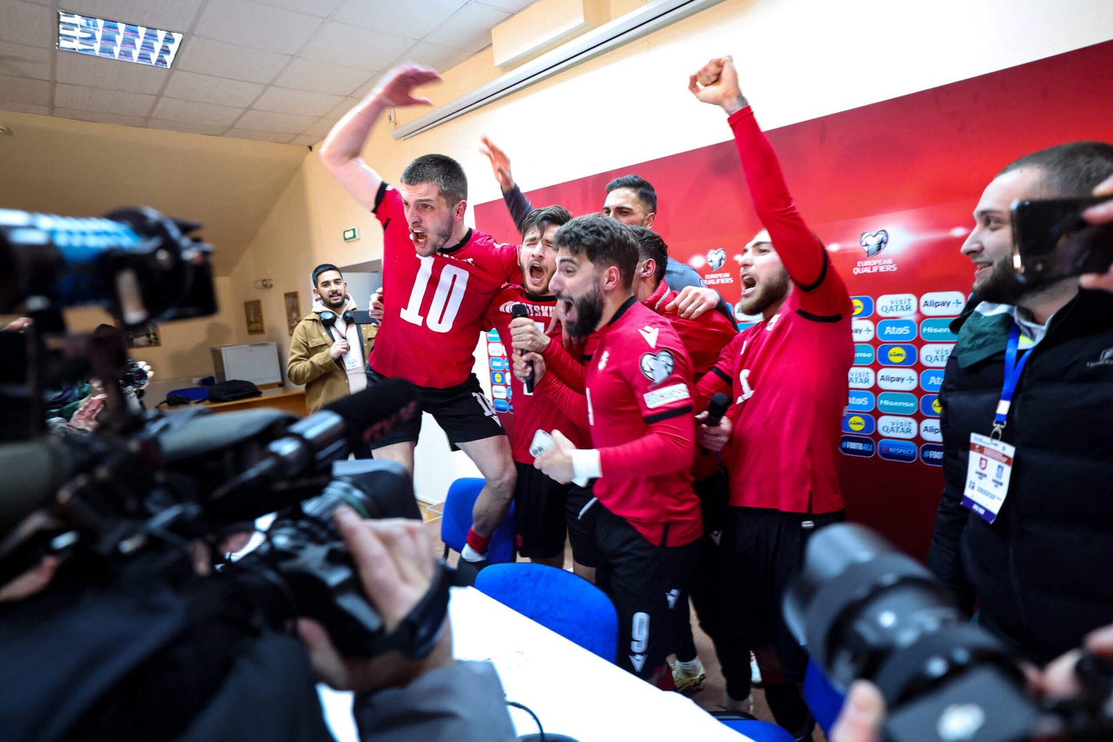 Georgia players celebrate after securing qualification for this summer's Euros (Giorgi Arjevanidze/AFP via Getty Images)